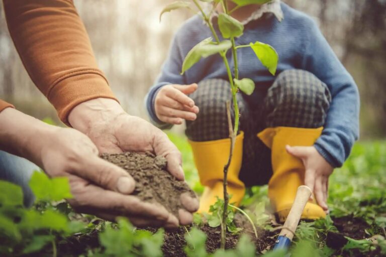 family planting tree